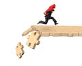 Man carrying arrow up symbol running on breaking puzzle path
