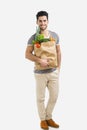 Man carrying a bag full of vegetables Royalty Free Stock Photo