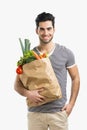 Man carrying a bag full of vegetables Royalty Free Stock Photo