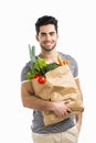 Man carrying a bag full of vegetables Royalty Free Stock Photo