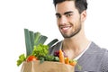 Man carrying a bag full of vegetables Royalty Free Stock Photo