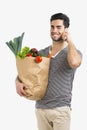 Man carrying a bag full of vegetables Royalty Free Stock Photo