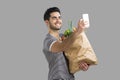 Man carrying a bag full of vegetables Royalty Free Stock Photo