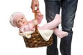 Man carrying a basket with cheerful baby