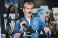 man carrying bike on shoulder