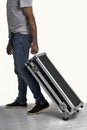 Man carrying black briefcase on white background