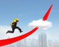 Man carrying dollar sign running on red arrow up graph Royalty Free Stock Photo