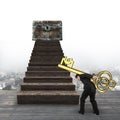 Man carrying Euro sign key toward treasure chest Royalty Free Stock Photo