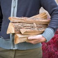 Man carrying firewood logs Royalty Free Stock Photo