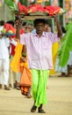 Man carrying fruits offering tray over the head during the festive season at Ruhunu Maha