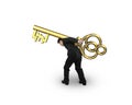 Man carrying golden treasure key in pound symbol shape Royalty Free Stock Photo