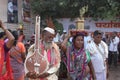 Man carrying harp and woman carrying tulsi during Alandi yatra, Alandi Devachi, Pune