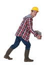 Man carrying heavy brick Royalty Free Stock Photo