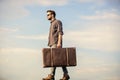 Man carrying his things in baggage. Business trip. Handsome guy traveler. Travel with luggage. Vacation time. Guy