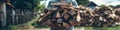 Man carrying a large stack of chopped firewood for heating outdoors Royalty Free Stock Photo