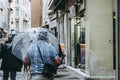 Man carrying large transparent umbrella