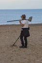 Man carrying Metal Detector