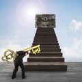 Man carrying pound symbol key toward treasure chest Royalty Free Stock Photo