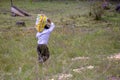 A man carrying a sack of onions