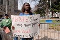 Man carrying sign urging Gov Deal to veto HB87