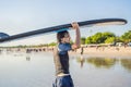 Man carrying surfboard over his head. Close up of handsome guy with surfboard on head at beach. Portrait of man carrying Royalty Free Stock Photo