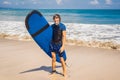 Man carrying surfboard over his head. Close up of handsome guy w Royalty Free Stock Photo