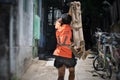 Man carrying wood to construction site