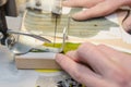 A man carves a toy on the machine. Making wooden toys. Toys made of wood. Safe toys. Educational toys, sand wooden toys Royalty Free Stock Photo