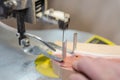 A man carves a toy on the machine. Making wooden toys. Toys made of wood. Safe toys. Educational toys, sand wooden toys Royalty Free Stock Photo