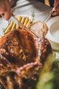 Man carving roasted turkey