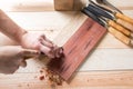 Man carving wood with handtools Royalty Free Stock Photo