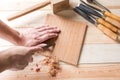 Man carving wood with handtools Royalty Free Stock Photo