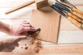 Man carving wood with handtools Royalty Free Stock Photo