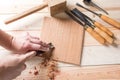 Man carving wood with handtools Royalty Free Stock Photo