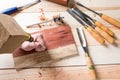 Man carving wood with handtools Royalty Free Stock Photo