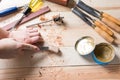 Man carving wood with handtools Royalty Free Stock Photo