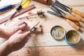 Man carving wood with handtools Royalty Free Stock Photo