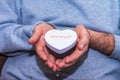 Man holding a heart shaped gift box Royalty Free Stock Photo