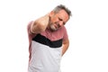 Man in casual tshirt touching back muscular pain with copyspace