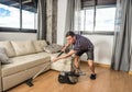 Man vacuuming the living room floor Royalty Free Stock Photo