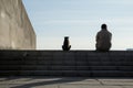 a man and a cat sitting on steps Royalty Free Stock Photo