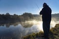 Man catches fish on the river Snov in autumn, October 2018. Ukraine