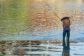 Man catching fish in Fenghuang