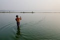 A man catching fish on the lake in Mandalay, Myanmar Royalty Free Stock Photo