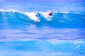 Man catching an ocean wave near the coast. Extreme water sports and outdoor active lifestyle. With copy space for text. - Image