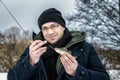 The man caught the first fish on ice fishing
