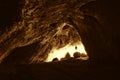 Man at cave entrance Royalty Free Stock Photo