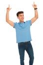 Man celebrating with both hands raised Royalty Free Stock Photo