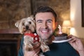 Man celebrating his dog first birthday Royalty Free Stock Photo