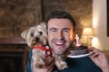 Man celebrating his dog first birthday Royalty Free Stock Photo